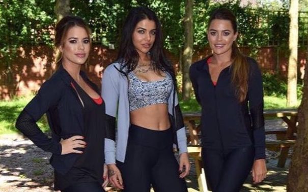 Twin sisters Leanne Williams, left, and Nicki Hughes, right, founders of 2ToneFit, with personal trainer Rayner Jordan