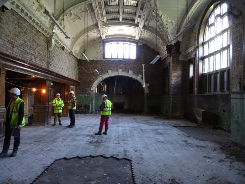 Workmen assess the old library